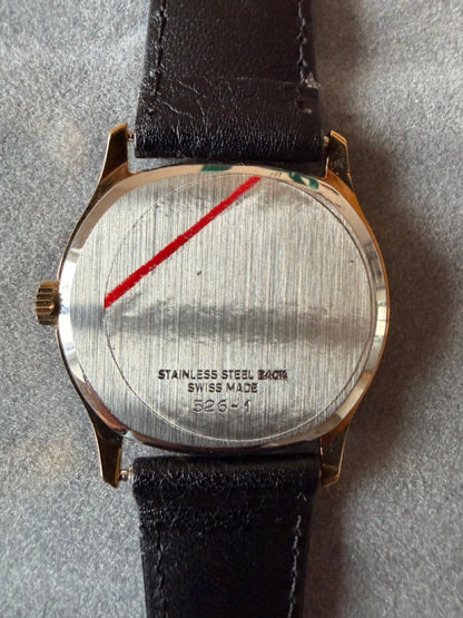 Montre Orano NOS Suisse tonneau plaqué or 70s ultra fine