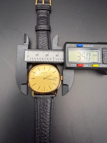 Montre Orano NOS Suisse tonneau plaqué or 70s ultra fine